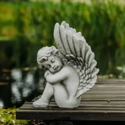 Gartendekoparadies Enfants & Anges-Ange assis avec des ailes