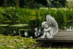 Gartendekoparadies Enfants & Anges-Ange assis avec des ailes