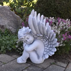 Gartendekoparadies Enfants & Anges-Ange assis avec des ailes