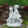 Gartendekoparadies Enfants & Anges-Garçon et fille avec brouette