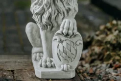 Gartendekoparadies Animaux-Lion avec bouclier sur la patte gauche