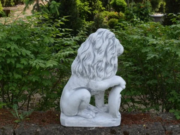 Gartendekoparadies Animaux-Lion avec bouclier sur la patte droite