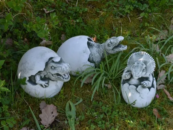 Gartendekoparadies Animaux-Un petit dinosaure sort de l'œuf