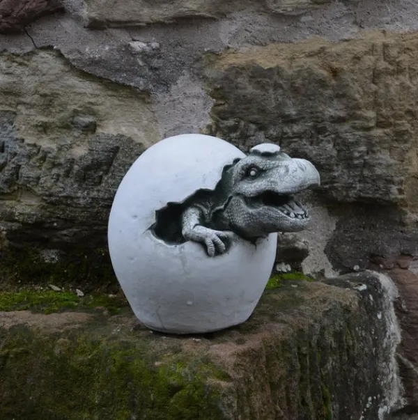 Gartendekoparadies Animaux-Un petit dinosaure sort de l'œuf